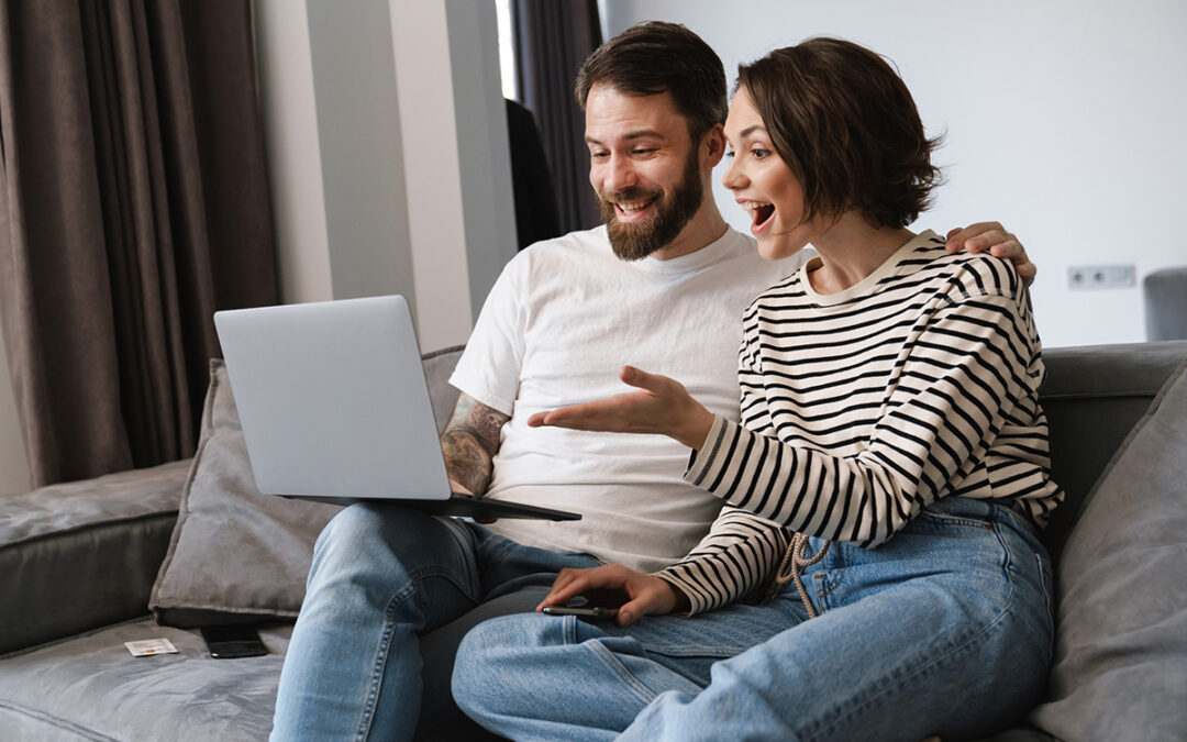 Engaged couple looking at wedding venue virtual tour